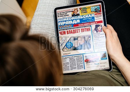 Paris, France - Apr 15, 2019: Woman Reading Komsomolskaya Pravda On Ipad Pro Apple News Plus Digital