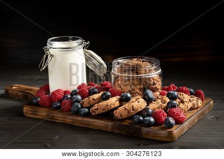 Biscuits, Berries And Milk On Wooden Bottom, Side View.