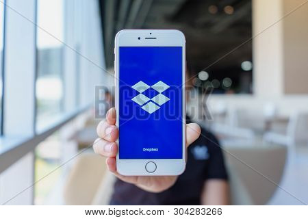Chiang Mai, Thailand - Feb 22,2018: Woman Holding Apple Iphone 6s Rose Gold With Dropbox On Screen. 