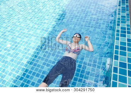Pregnant Women Exercise Swimming In Pool