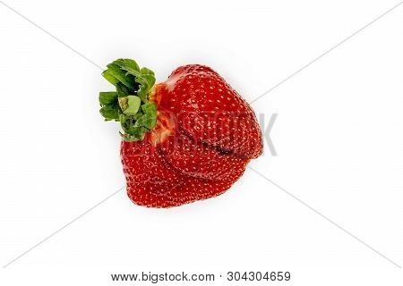 Fresh Organic Strawberry. Imperfect Isolated Fruit. Closeup. Summer Organic Nutrition. Red Juicy Ber