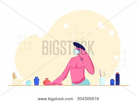 Young Man With Bare Torso Shaving In Bathroom Passing Razor For Beard While Looking At Mirror. Morni