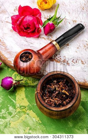 Smoking Pipe And Floral Tobacco