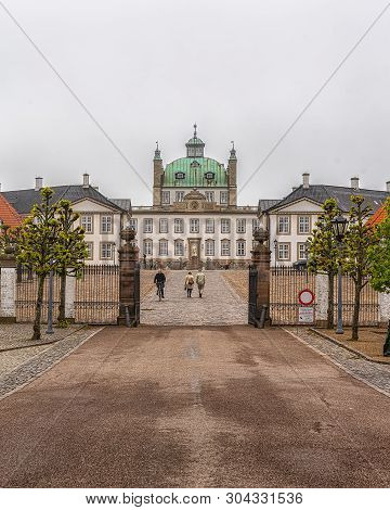 Fredensborg, Denmark - May 18, 2019: Fredensborg Palace Is A Palace Located On The Eastern Shore Of 