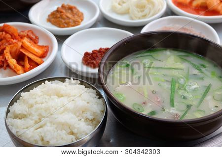 Korean Food Dwaeji-gukbap. Rice And Pork Soup In A Steaming Stone Bowl.