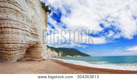 Beautiful Summer Panoramic View On Wild Tropical Beach Vignanotica, Blue Sea With Waves, Sky With Wh