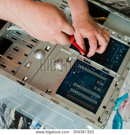 Repair Of The System Unit Of The Stationary Personal Computer By Means Of The Cross Screwdriver With