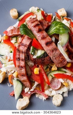 Salad With Grilled Sausage Paprica Cucumber And Croutons