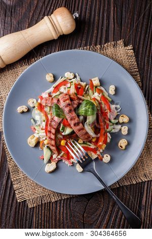 Salad With Grilled Sausage Paprica Cucumber And Croutons