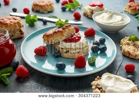 Classic English Scones With Clotted Cream, Strawberries Jam And Other Fruit