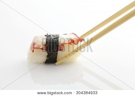 Octopus Sushi Isolated With Chopsticks In White Background