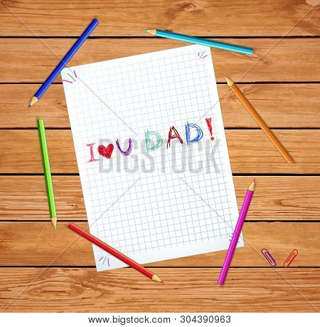 I Love You Dad Kids Hand Drawn  Inscription On Checkered Notebook Sheet Or Graphing Paper On Wooden 