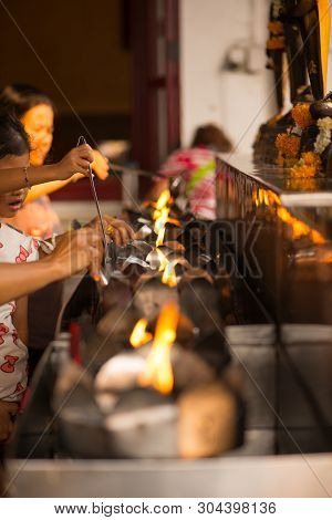 Bangkok, Thailand - December 22, 2018 : People Fill Oil On Lantern In Wat Rakhang Khositaram Bangkok