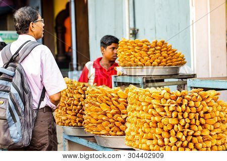 April 2019, Puri, Orissa, India. Tourists Buying Khaja Snacks,layered Fritters Dunked In Sugar Syrup