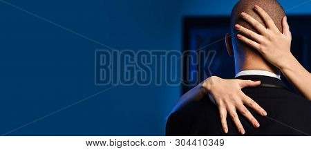 Couple Indoors. Close Up Woman Hug Man In Elegant Formal Business Suit. Female Hands On The Man Bald