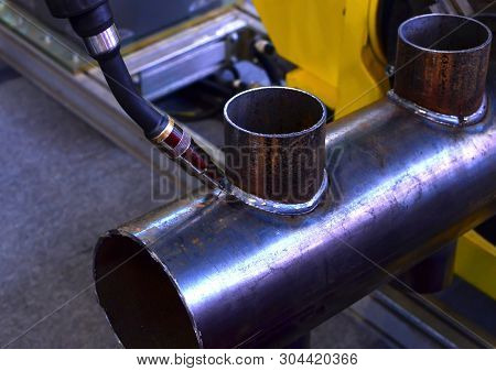 Industrial Automatic Robotic Welding Arm For Metal Welding Operations. Weld Seam Close-up. Shooting