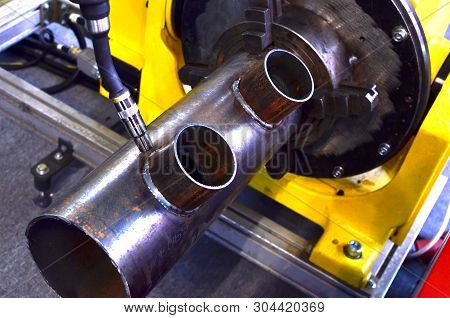 Welding Robotic Arm At Industrial Manufacture Factory. Weld Seam Close-up. Shooting In Real Conditio