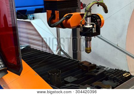 Cnc Laser Plasma Cutting Head, Close-up. Modern Technology In Process At Metalworking Manufacturing