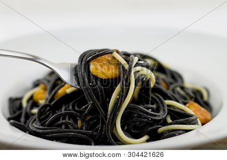 Italian Black Spaghetti, Alla Veneziana, With Grilled Prawns And Dried Tomatoes. With Olive Oil, Gar