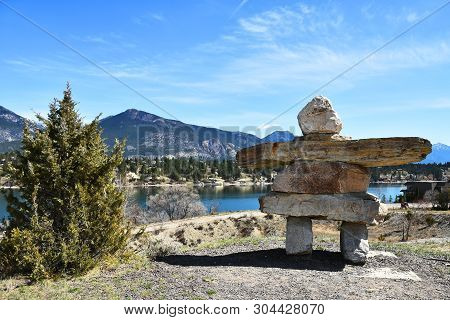 An Image Of A Stone Inukshuk Over Looking The Town Of Golden, British Columbia, Canada.