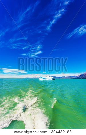 Excursion by boat to the huge white-blue glacier. Unique lake Viedma in Argentine Patagonia. The lake is surrounded by mountains