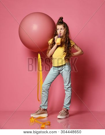 Cool And Fashion Teen Girl In Jeans And Yellow T-shirt Stepped On Big Pink Balloon Yellow Tape, Drin