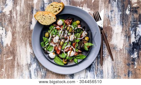 Mediterranean Salad With Fresh Green Salad With Mozzarella, Tomatoes, Olives, Onion And Balsamic Dre