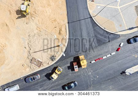 Top View Of Road Construction With Heavy Road Rollers Doing Asphalt Pavement Works