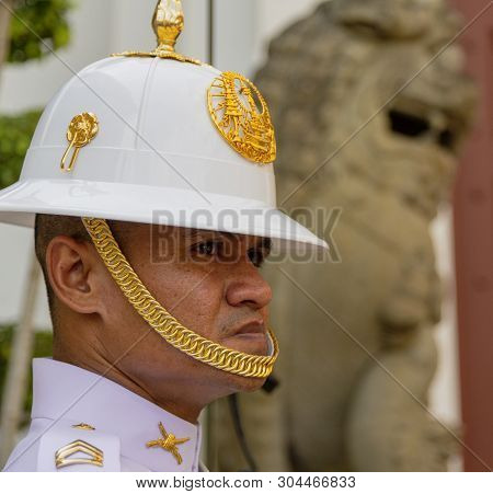 Bangkok, Tahiland - 2019-03-04 - Man Stands Guard At The Grand Palace.