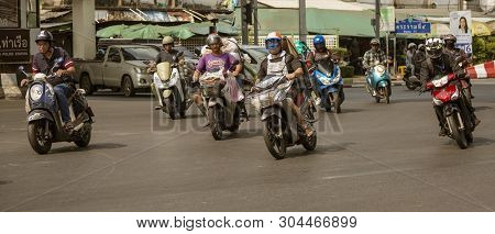 Bangkok, Tahiland - 2019-03-19 - Motorcycles Fill The Streets Of Bangkok And Zoom Ahead At Traffic L