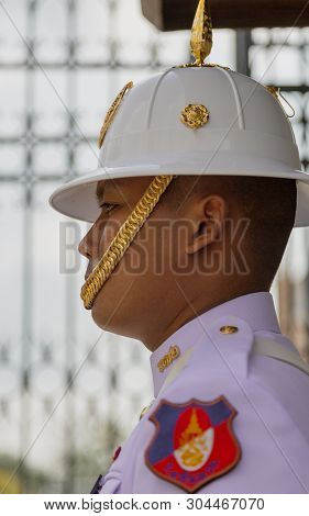 Bangkok, Tahiland - 2019-03-04 - Man Stands Guard At The Grand Palace.