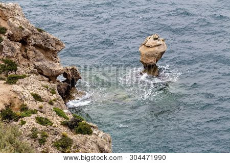 Seascape. Unusual Piece Of Rock In The Sea Near Small Cove Of The Corinthian Gulf (loutraki-perachor