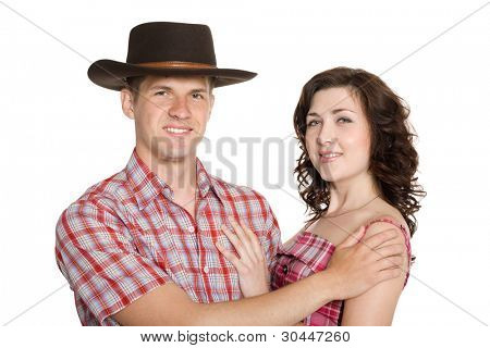 Glad pige og en fyr i en stetson. Isoleret på hvid.