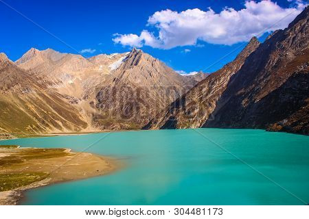 Deep Green Water Of Sheshnag Lake With Amarnath Mountain Range In The Background