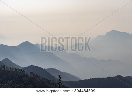 Mountains With White Mist In The Dawn Image Taken At Kodaikanal Tamilnadu India From Top Of The Hill
