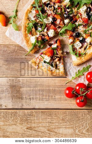 Vegetable Italian Pizza With Tomatos On Wodeen Background, Copy Space, Top View, Vertical