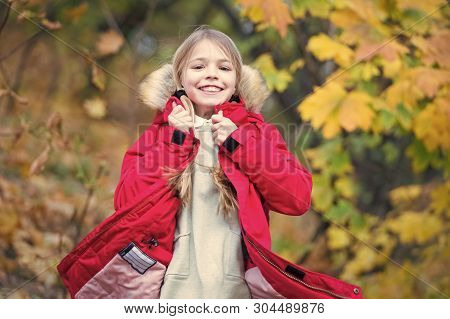 Feel So Cozy In Warm Jacket. Child Blonde Long Hair Walking In Warm Jacket Outdoor. Girl Happy In Co