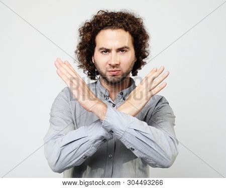 emotion  and people concept:  Man making time out gesture over white  backgound