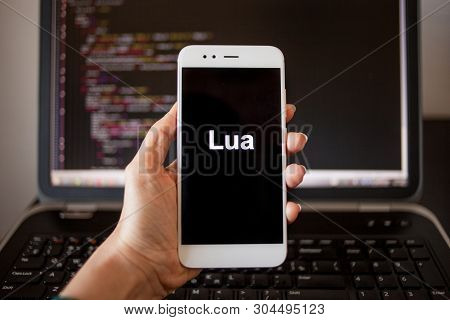 Mobile Application Development, Programming Language Lua For Mobile Development. Smartphone In Hand 