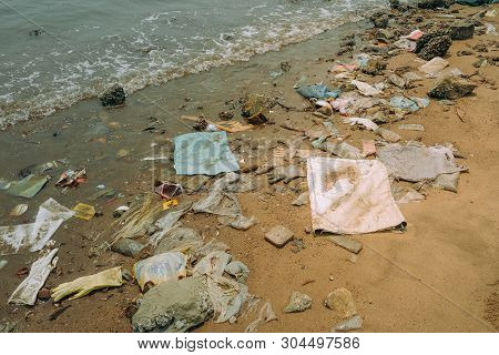 Trash, Plastic, Garbage, Bottle... Environmental Pollution On The Beach. Royalty High-quality Free S