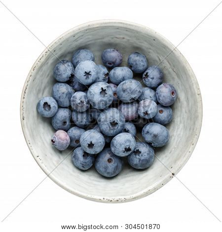 Fresh Ripe Blueberry Berries In Bowl Isolated On White Background. Top View. Flat Lay.