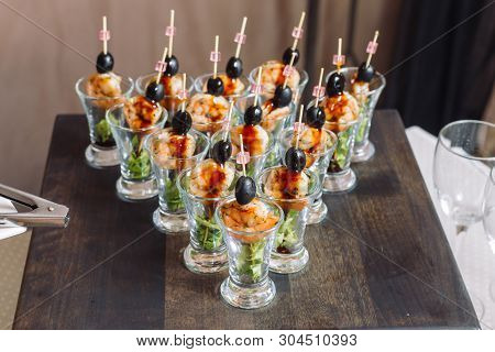 Kanape From Shrimps. Luxury Catering Exhibited On A Wooden Board.