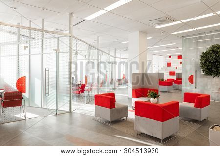 Minsk, Belarus - May 23, 2019: Corner Of Modern Office With White Walls, Gray Floor, Open Space Area