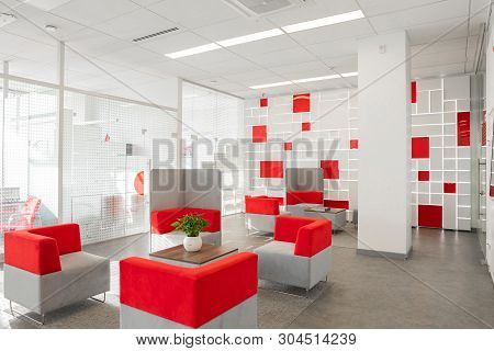 Minsk, Belarus - May 23, 2019: Corner Of Modern Office With White Walls, Gray Floor, Open Space Area