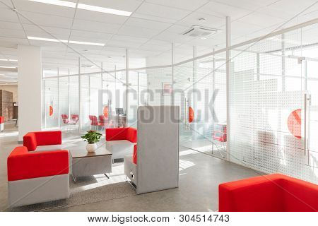 Minsk, Belarus - May 23, 2019: Corner Of Modern Office With White Walls, Gray Floor, Open Space Area