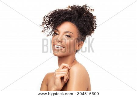 Beauty Portrait Of African American Woman With Clean Healthy Skin On White Background. Skin Care And