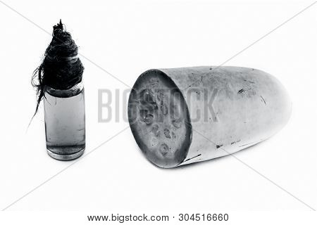 Raw Organic Cut Half Bottle Gourd Isolated On White Along With Its Extracted Beneficial Oil In A Sma