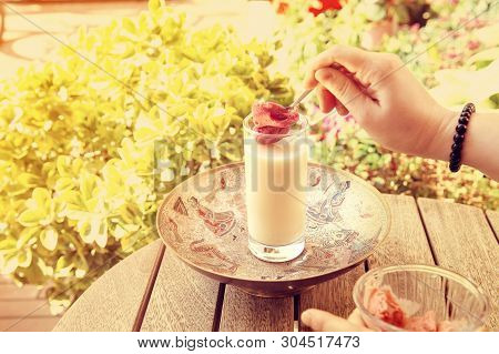 Boza. Traditional Turkish And Albanian Drink Served In Outdoor Summer Cafe Combined With Strawberry 
