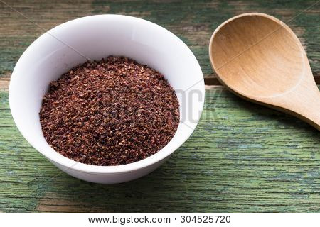 Ground Sumac Spice In White Bowl, Traditional Arabic Ingredient For Oriental Food