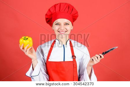 Woman In Cook Hat And Apron. Professional Chef In Kitchen. Cuisine. Housewife With Cooking Knife. Ha